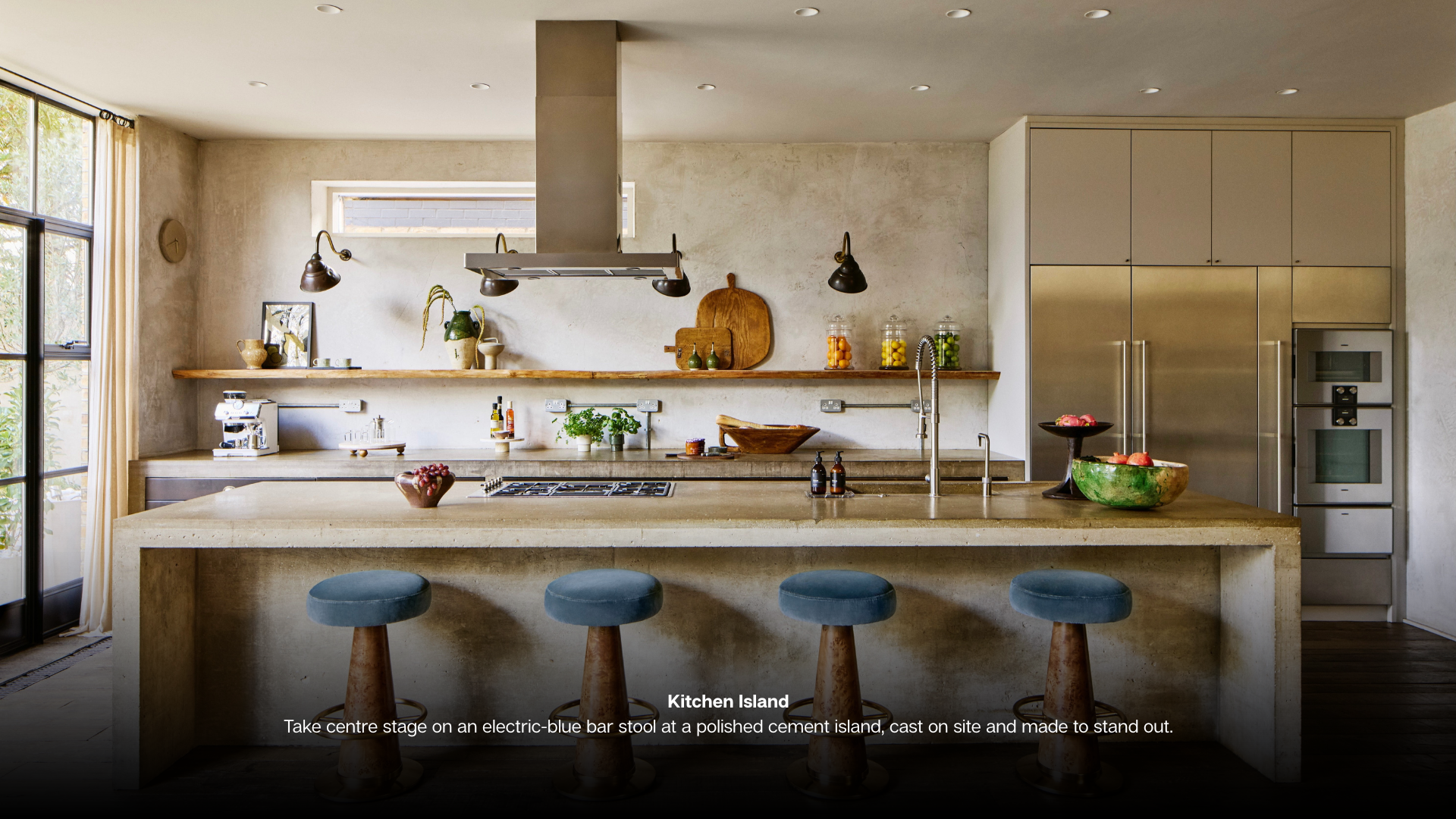 Living Room Make the most of cosy season in this living room where earth tones, velvet and wood creae warmth and spectacular windows frame garden views. Kitchen Island Take centre stage on a elect (1)